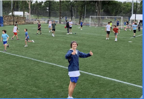 Counselor thumbs up on the field