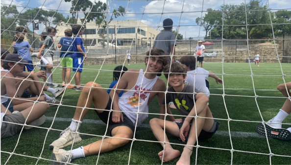 Campers behind the soccer net